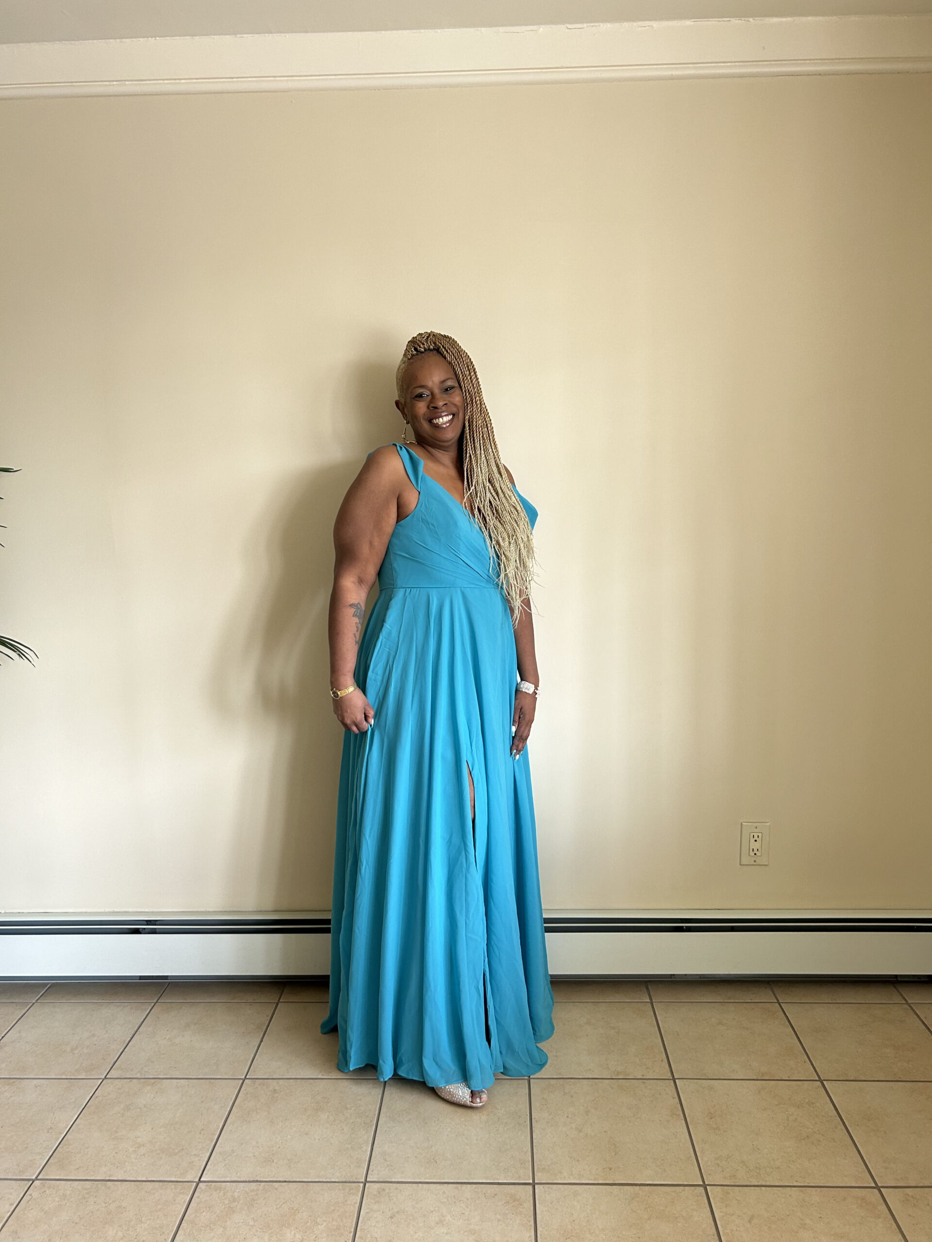 A woman wearing a blue dress